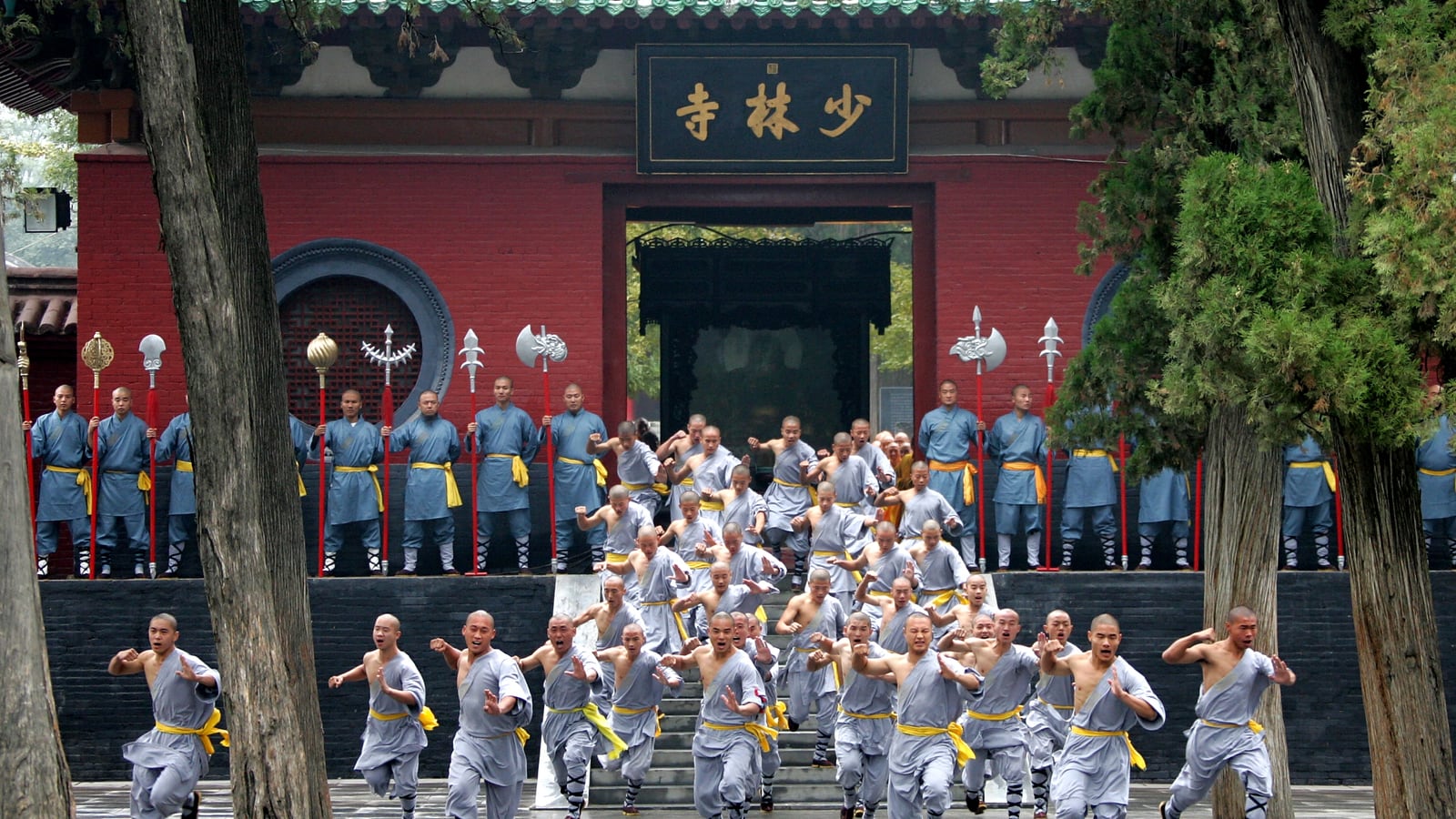 Shaolin kung fu monks at Shaolin Temple gate in Dengfeng, Henan